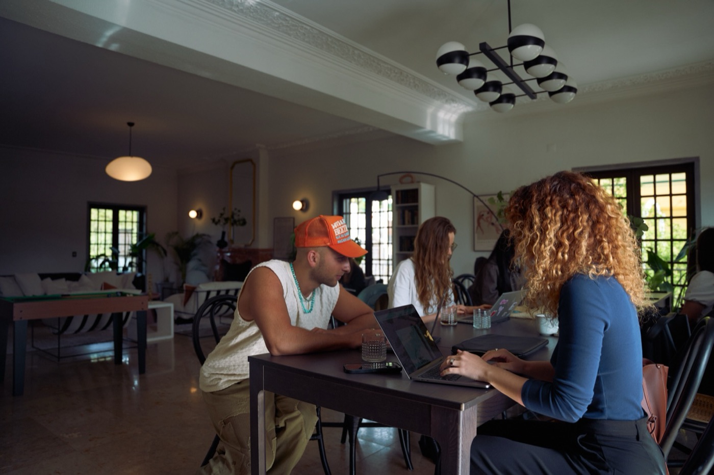 A group working together around one long table